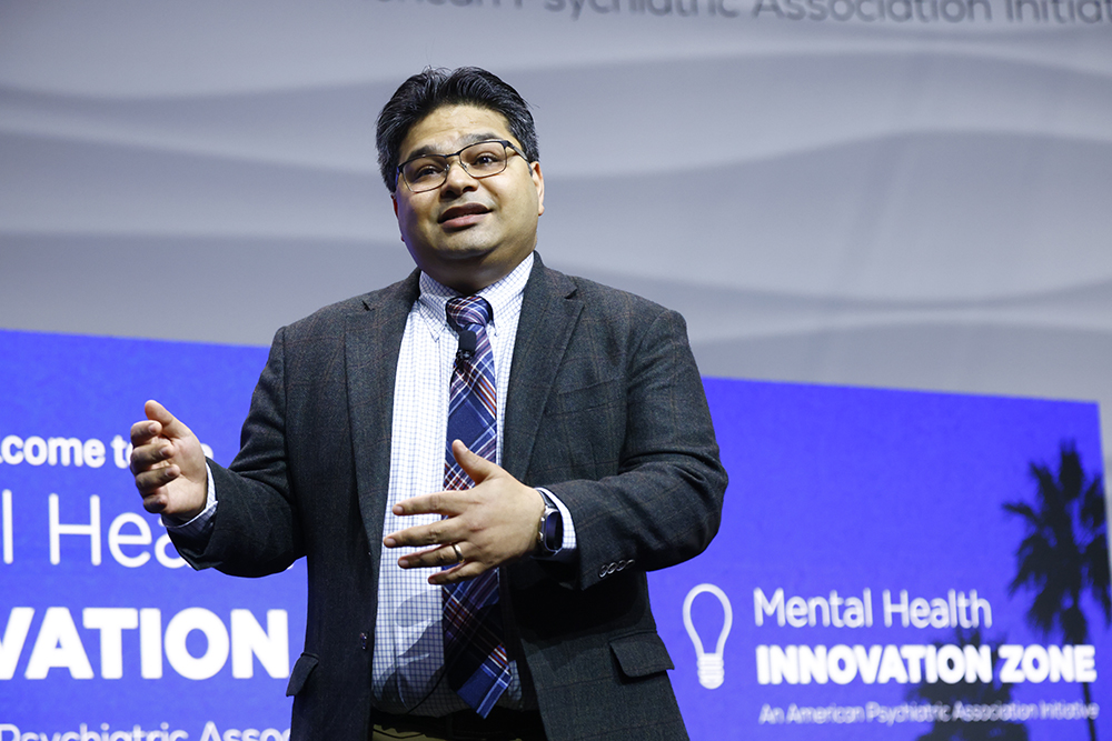 Host onstage at the 2025 MHIZ