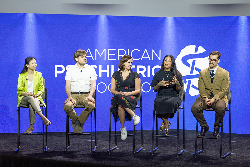 Panel of speakers onstage at the 2025 MHIZ