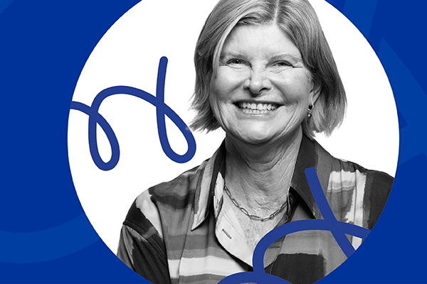 Woman smiling against a graphic blue abstract background